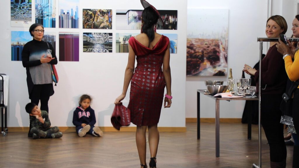 The dress is a shift dress with the bodice in silk and the skirt in African wax.
